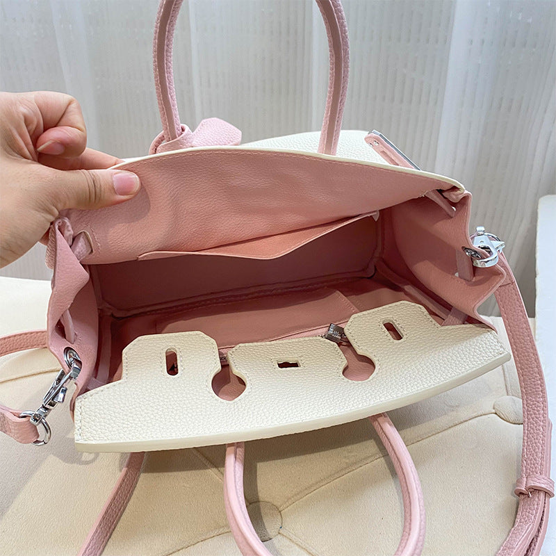 Interior view of a bi-color Pink and White inspired Birkin handbag in top grain leather, showing the spacious main compartment, a large slip pocket, and the matching pink leather lining.