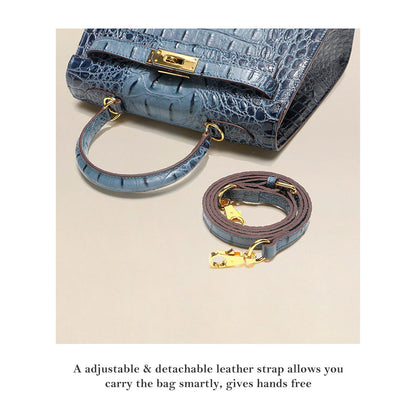 Blue crocodile embossed leather Kelly bag with a matching adjustable and detachable shoulder strap.
