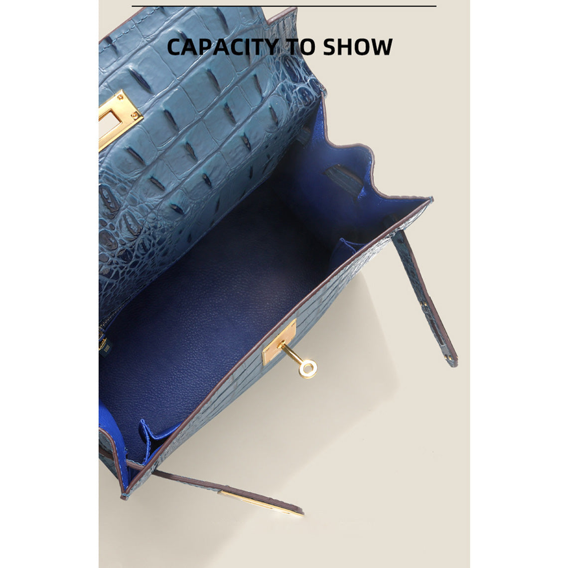 Interior view of the blue Kelly bag showing a spacious main compartment and flat slide pockets.