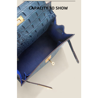 Interior view of the blue Kelly bag showing a spacious main compartment and flat slide pockets.