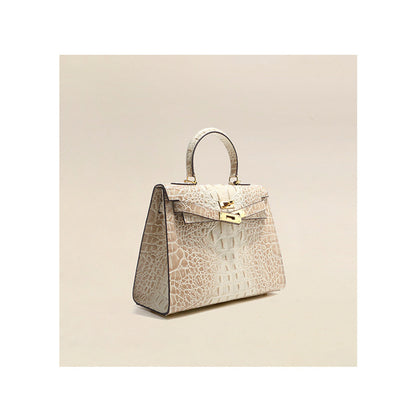 Himalayan White crocodile embossed leather Kelly bag with gold hardware and top handle.