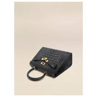Top view of a Black crocodile embossed leather Kelly bag with gold hardware.