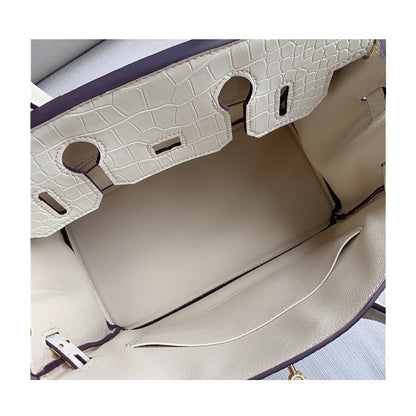 Interior view of a white Croc Flap Berkin Bag showcasing the spacious main compartment, a large slide pocket, and the underside of the crocodile embossed leather flap.