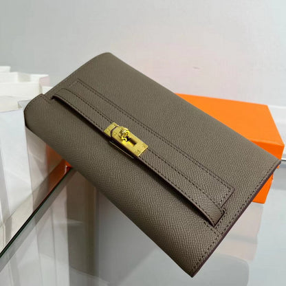 Front view of a Khaki  inspired Kelly to go wallet in textured cowhide leather, featuring the iconic golden Kelly closure.