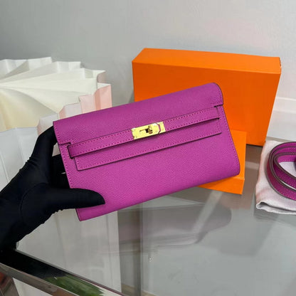 Front view of a Rose Purple inspired Kelly to go wallet in textured cowhide leather, showcasing the iconic golden Kelly closure and vibrant Epsom-style grain.