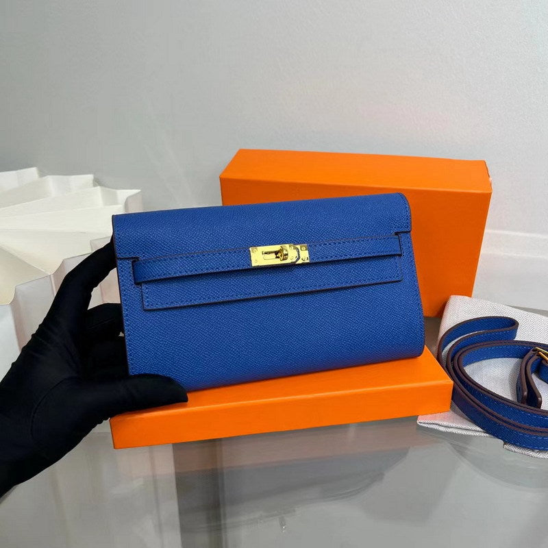Front view of a vibrant Blue Electric inspired Kelly to go wallet in textured cowhide leather, featuring the iconic golden Kelly closure.